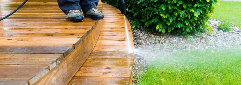 cleaning deck with a pressure washer